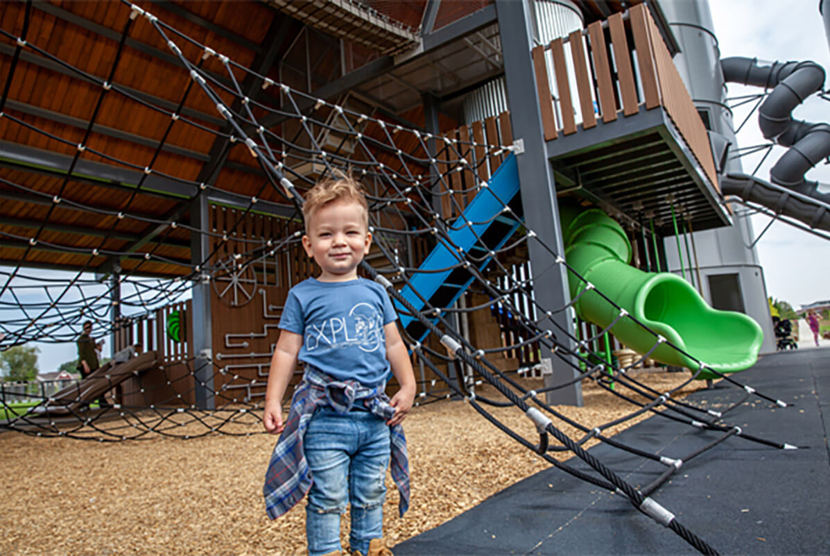 Kid playing at Twin Silo Park in Fort Collins